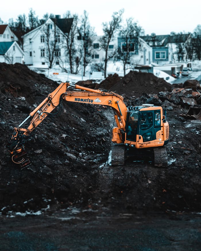 pexels-photo-2058729 A Komatsu excavator working on a snowy construction site in Tromsø, Norway.
